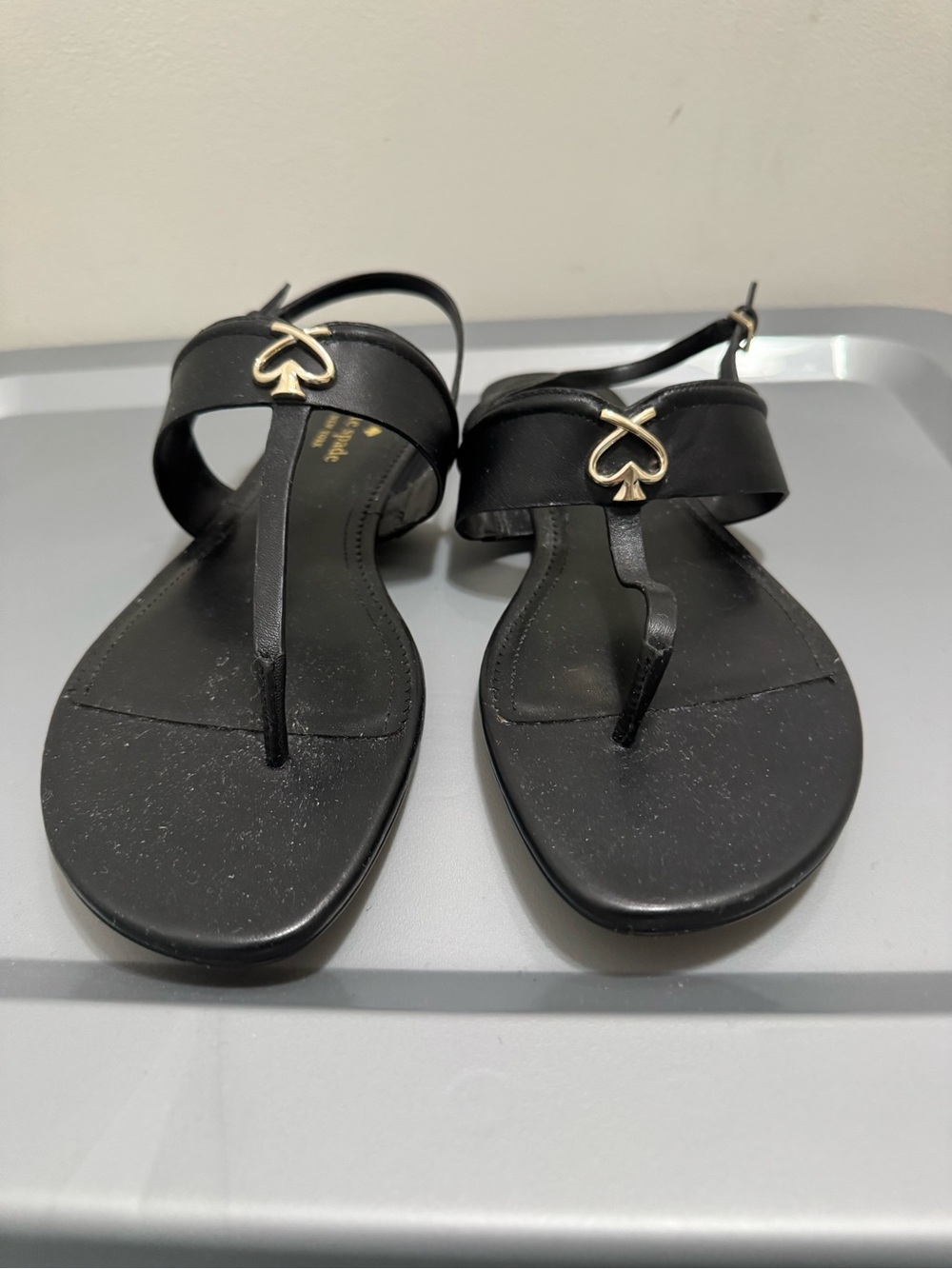 kate spade Black Leather Thong Sandals with Gold Spade Accent